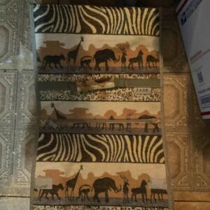 Rolling bag by JADE. SAFARI DESIGN.Bag is 22.25x 13 x 5”.  H110